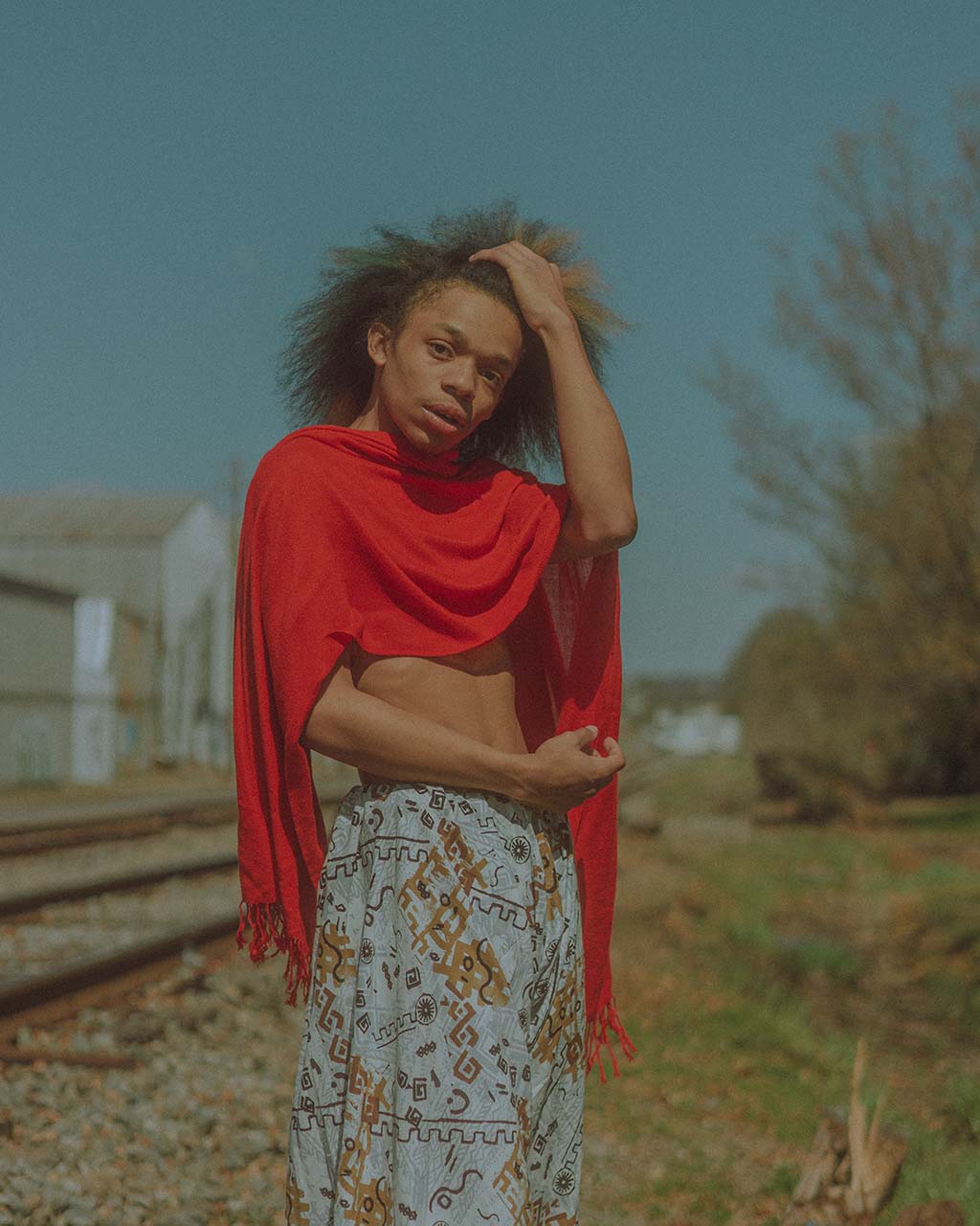 person posing in red scarf