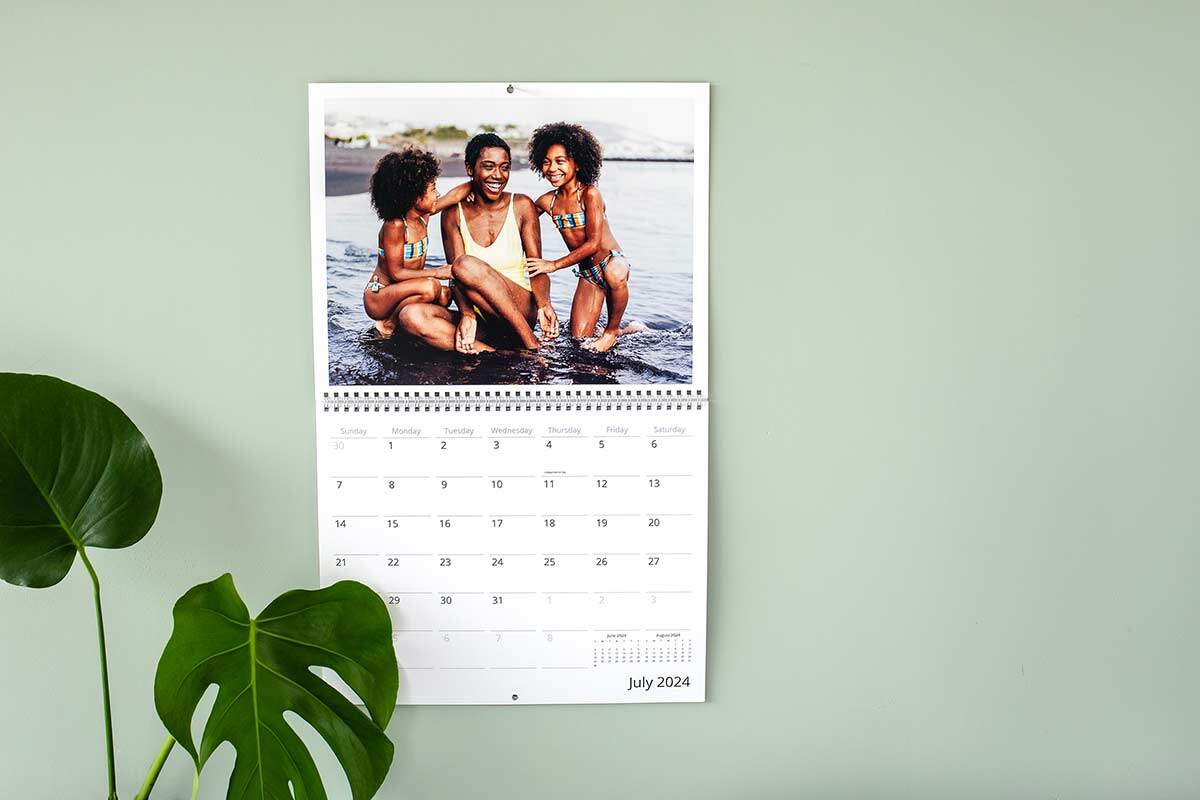 Personalized photo calendar with photo of mother and two daughters at the beach