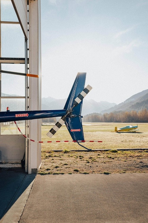 tail of a plane in mountain landscape